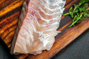 filé do branco peixe sem pele e ossos fresco frutos do mar saudável refeição Comida lanche em a mesa cópia de espaço Comida fundo rústico topo Visão pescatarian dieta foto