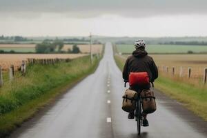 uma homem passeios uma bicicleta em a esvaziar estrada entre uma lindo campo, a conceito do ciclismo viagem generativo ai foto