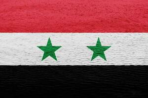 bandeira do sírio árabe república em uma texturizado fundo. conceito colagem. foto