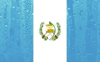 3d bandeira do Guatemala em uma vidro foto