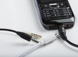 acessórios de smartphone fone de ouvido, cabo de carregamento para celular com botão de pressão antigo foto