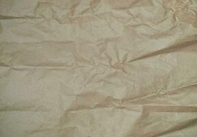 Castanho invólucro papel textura, amassado limpar \ limpo folha. construir amassado papel, cartão fundo. papel de parede ou pergaminho abstrato projeto, horizontal rude caixa, velho material foto