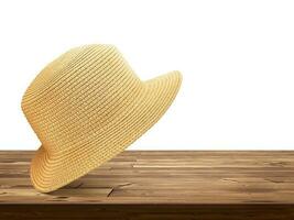 vintage Palha chapéus. colocada em de madeira mesa. isolado em branco fundo. foto