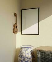 clássico minimalista quadro, Armação brincar poster suspensão em a bege parede dentro a canto do a quarto com vaso e ukulele decoração foto