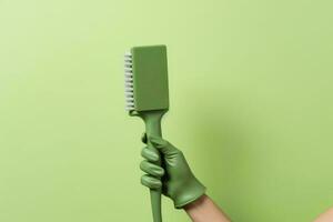 limpeza ferramenta dentro uma mão dentro uma verde borracha luva. generativo ai foto