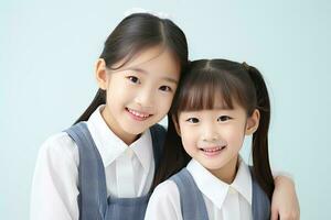 dois chinês alunas dentro escola uniformes isolado em a azul fundo. ai gerado foto