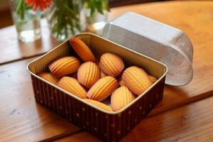 madeleines caixa dentro a cozinha mesa Comida fotografia ai gerado foto