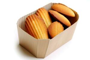 madeleines caixa dentro a cozinha mesa Comida fotografia ai gerado foto