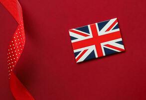 União jack bandeira do ótimo Grã-Bretanha em vermelho fundo, da rainha platina jubileu e feriado celebração foto