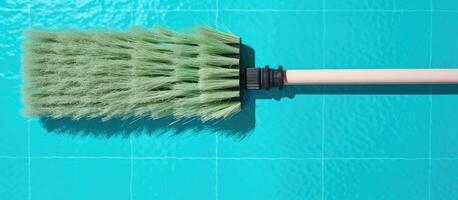 foto do uma azul piscina com uma verde escova flutuando em a superfície com cópia de espaço
