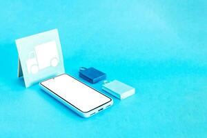 conectados compras e envio. Entrega conceito. inteligente telefone e papel formas em azul fundo. foto