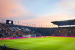 embaçado estádio fundo às crepúsculo. foto