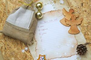 uma Lista do Natal desejos em uma peça do papel foto