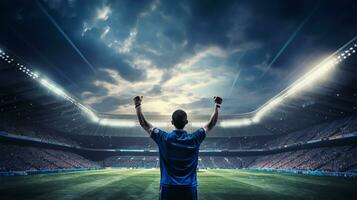 futebol jogador em a campo do estádio às noite. foto