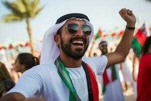 emirati de praia futebol fãs a comemorar uma vitória foto