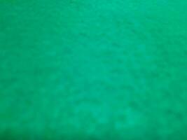 desfocado abstrato tapete fundo dentro brilhante tosca verde cor foto