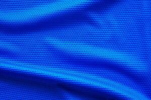 camisa de futebol azul roupas tecido textura esportes desgaste fundo, close-up vista superior foto