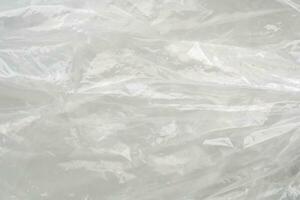textura de saco plástico transparente no fundo branco foto
