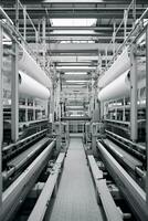 moderno têxtil fábrica com automatizado teares tecelagem padrões ai generativo foto
