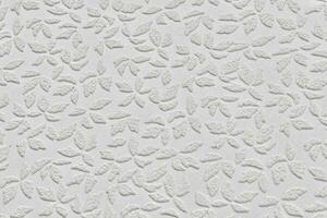 branco papel papel de parede textura com abstrato floral recorrente padronizar fechar acima. gesso gravado muro. foto