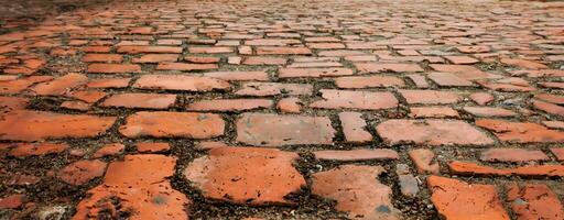 calçada portuguesa calçada fechar acima do a detalhe paralelepípedos dentro a velho rua estrada superfície fez do Castanho retangular pedras.antigas estrada granito pedras 3d ilustração foto