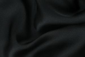 tecido de fundo. tecido têxtil escuro com textura e fundo de cortina padrão foto