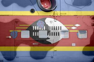 Suazilândia bandeira retratado em lado parte do militares blindado helicóptero fechar-se. exército forças aeronave conceptual fundo foto
