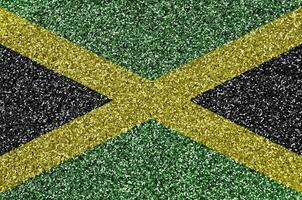 Jamaica bandeira retratado em muitos pequeno brilhante lantejoulas. colorida festival fundo para festa foto