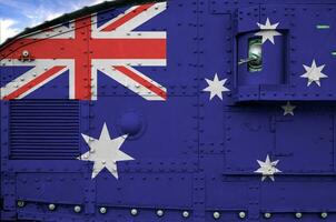 Austrália bandeira retratado em lado parte do militares blindado tanque fechar-se. exército forças conceptual fundo foto