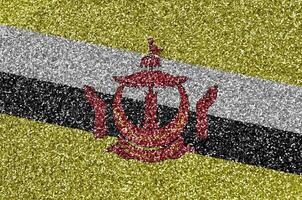 brunei darussalam bandeira retratado em muitos pequeno brilhante lantejoulas. colorida festival fundo para festa foto