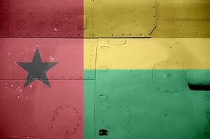 Guiné bissau bandeira retratado em lado parte do militares blindado helicóptero fechar-se. exército forças aeronave conceptual fundo foto