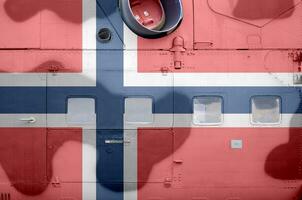 Noruega bandeira retratado em lado parte do militares blindado helicóptero fechar-se. exército forças aeronave conceptual fundo foto