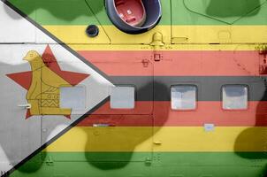 Zimbábue bandeira retratado em lado parte do militares blindado helicóptero fechar-se. exército forças aeronave conceptual fundo foto