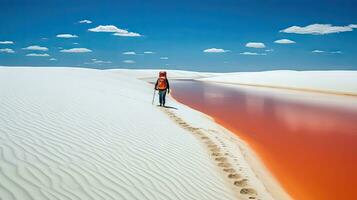 turistas caminhando em deserto areia dunas com vermelho rio aéreo Visão às pôr do sol, gerado com ai foto