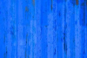 textura de parede de metal descascando azul e material sujo, fundo de textura áspero foto
