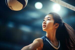 fêmea voleibol jogadoras estão competindo em a interior voleibol quadra foto