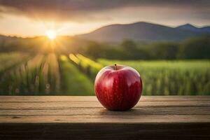 uma vermelho maçã senta em uma de madeira mesa dentro frente do uma campo. gerado por IA foto