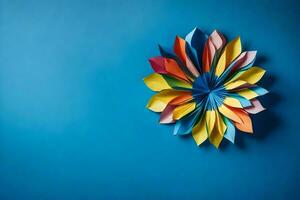 uma colorida origami flor em uma azul muro. gerado por IA foto