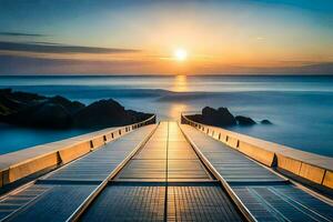 uma grandes ponte conduzindo para a oceano às pôr do sol. gerado por IA foto