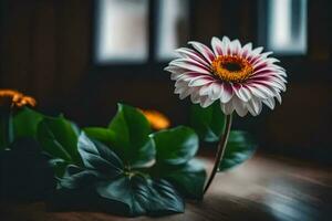 uma solteiro flor sentado em uma mesa dentro frente do uma janela. gerado por IA foto