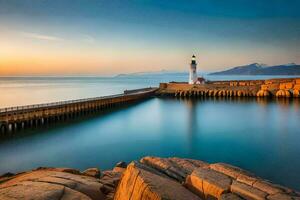 uma farol senta em a pedras às pôr do sol. gerado por IA foto