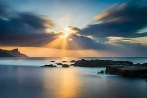 pôr do sol sobre a oceano com nuvens e pedras. gerado por IA foto