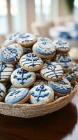 náutico tema com azul e branco decoração, âncora, e barco a vela biscoitos foto