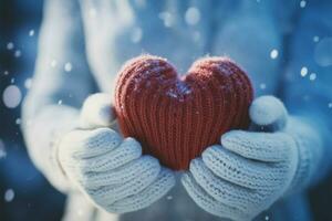 Nevado coração mantido de fêmea mãos dentro caloroso tricotado luvas ai gerado foto
