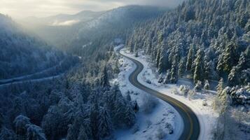 aéreo Visão do cheio de curvas ventoso estrada dentro neve coberto floresta. generativo ai foto