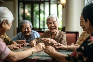 alegre grupo do ásia idosos jogando cartões e partilha riso dentro uma aposentadoria enfermagem lar. generativo ai foto