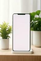 brincar Smartphone com em branco tela em mesa com verde plantar ai gerado foto