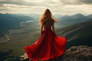 mulher dentro vermelho vestir em a topo do montanhas. liberdade e conquistas conceito. ai generativo. foto