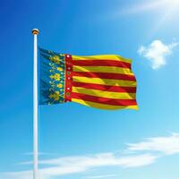 acenando bandeira do valencia é uma comunidade do Espanha em mastro de bandeira foto