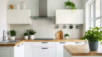 prata fogão de capuz dentro mínimo branco cozinha interior com plantar em de madeira bancada foto